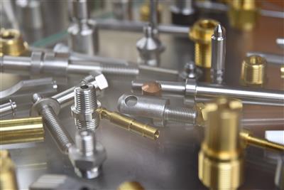 Precision machined metal components showcasing various geometries and finishes
