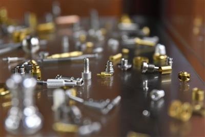 Close-up of a complex machined part showing precision tolerances and surface finish